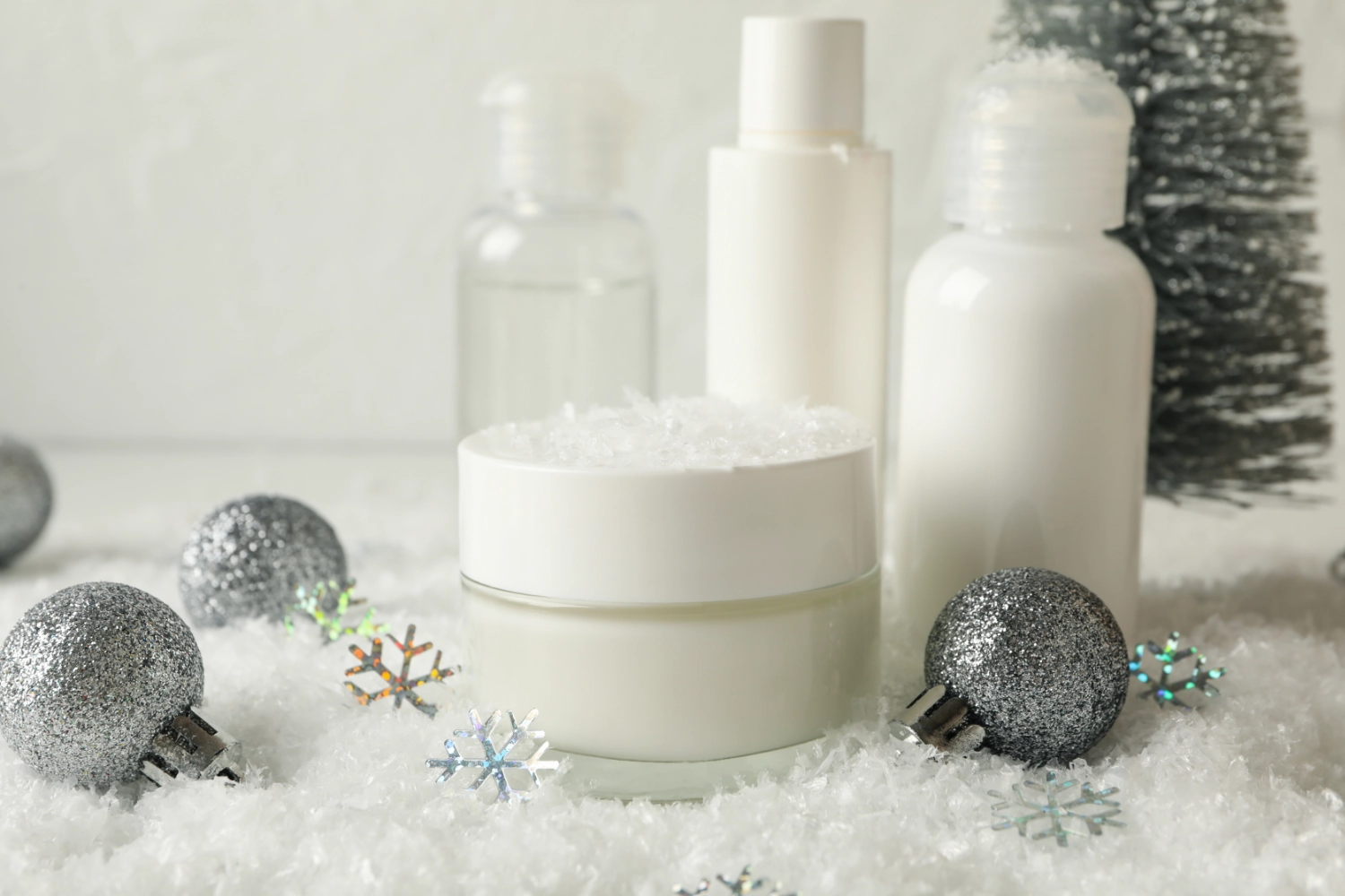 Close-up of winter marketing products arranged on a white carpet.